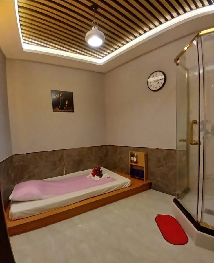 Spa treatment room with private shower